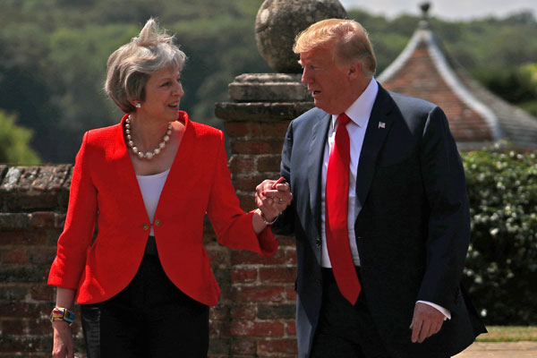 <p>May y Trump acuerdan negociar un gran tratado de libre comercio Reino Unido-EEUU</p>