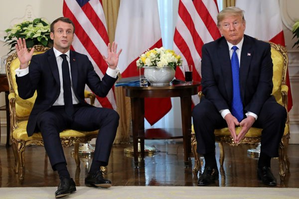 “Estoy decidido a defender los intereses de mi país y de Europa”, dijo Macron sentado junto a Trump. Foto: Reuters