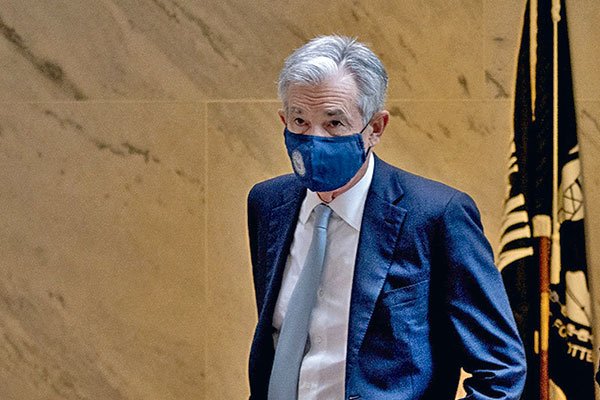 Fed acelerará reducción de su plan de compra de bonos y anticipa tres alzas de tasas el próximo año